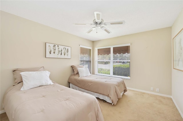 4995 Pepperwood Pl, Venice, FL 34293 - bedroom featuring baseboards, carpet floors, ceiling fan, and a textured ceiling