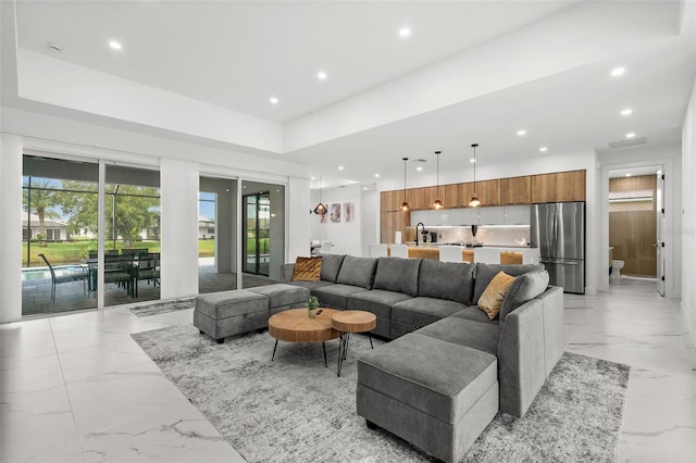 living room featuring sink