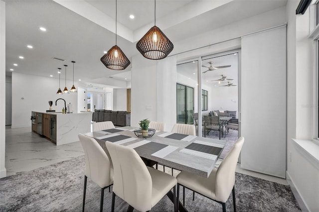 dining space featuring ceiling fan