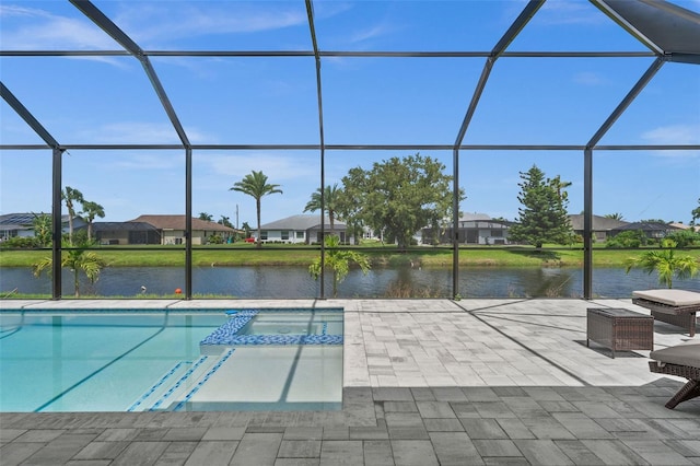 view of swimming pool featuring a lanai, a patio, and a water view