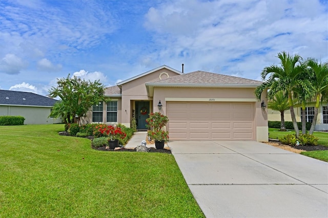 ranch-style home with a garage and a front lawn