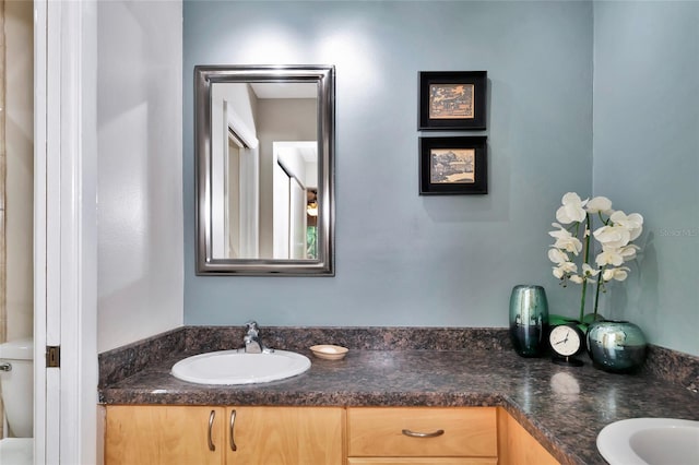 bathroom with vanity and toilet