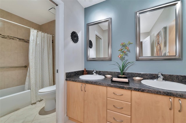 full bathroom with vanity, tile patterned floors, shower / bath combo with shower curtain, and toilet