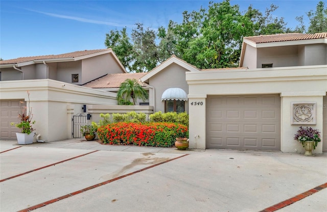 mediterranean / spanish-style home featuring a garage