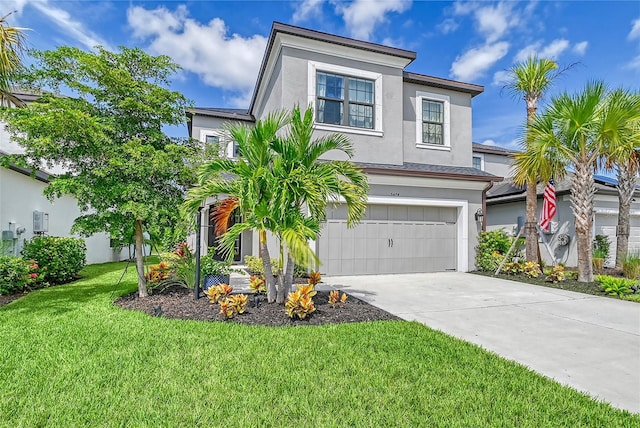 view of front of property featuring an attached garage, a front lawn, concrete driveway, and stucco siding