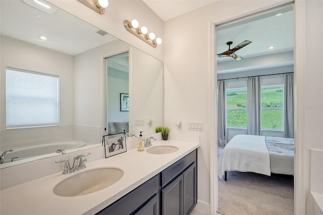 full bath featuring double vanity, ensuite bath, a sink, and a bath