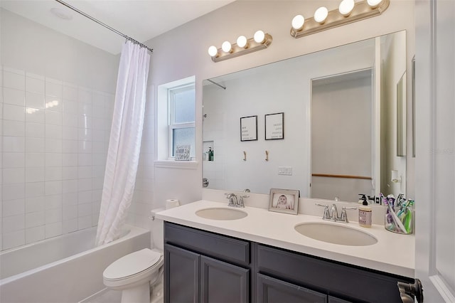 full bathroom with double vanity, shower / tub combo, toilet, and a sink