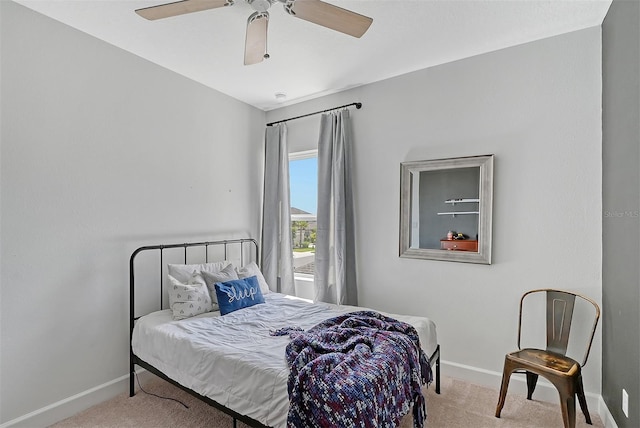 bedroom featuring carpet floors, baseboards, and a ceiling fan