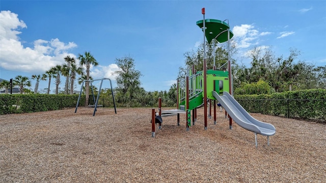 community jungle gym featuring fence