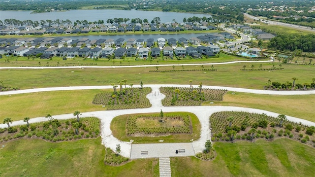 bird's eye view featuring a water view and a residential view