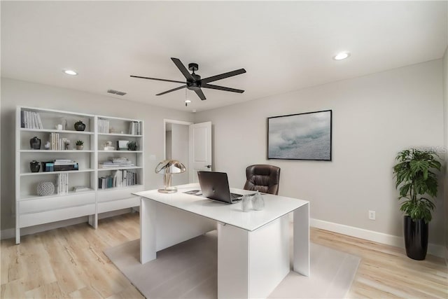 office space featuring light hardwood / wood-style flooring and ceiling fan