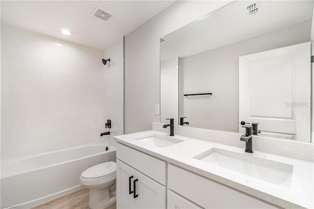 full bathroom featuring vanity, toilet, tub / shower combination, and wood-type flooring