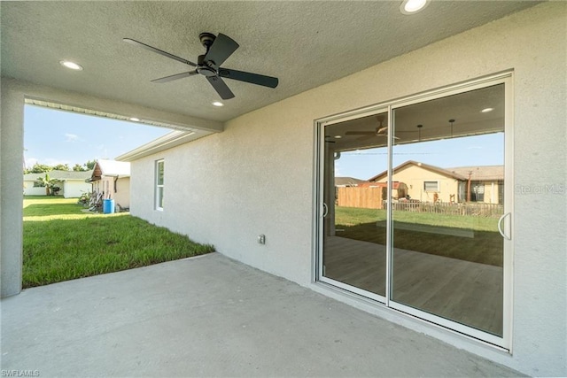 view of patio featuring ceiling fan