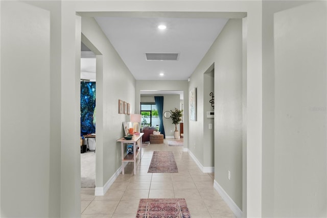 corridor featuring light tile patterned flooring