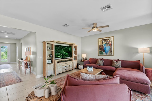 tiled living room with ceiling fan