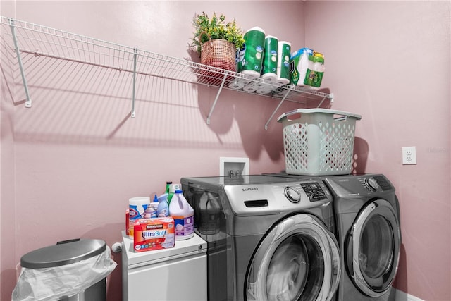 washroom with washer and clothes dryer