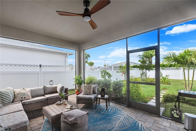 sunroom / solarium with ceiling fan