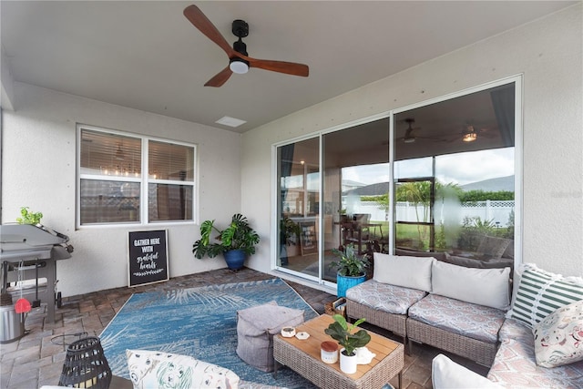 sunroom / solarium with ceiling fan