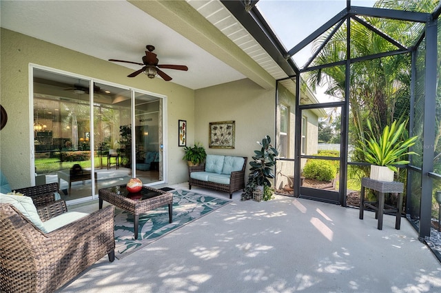 sunroom with a skylight and ceiling fan