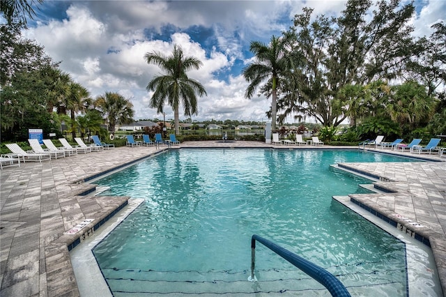 view of swimming pool with a patio