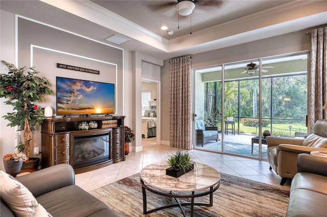 living room with a textured ceiling, light tile patterned floors, and ceiling fan