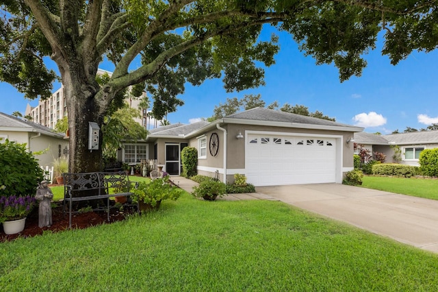 single story home with a garage and a front lawn