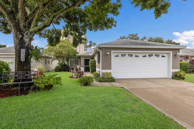 ranch-style house featuring a front yard and a garage