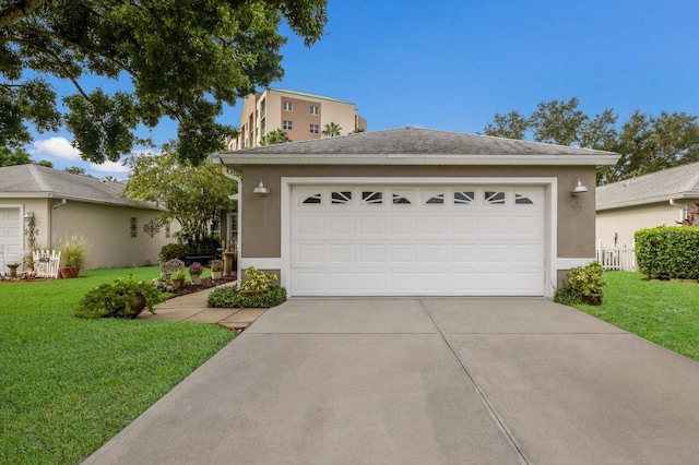 view of front of house featuring a garage and a front lawn