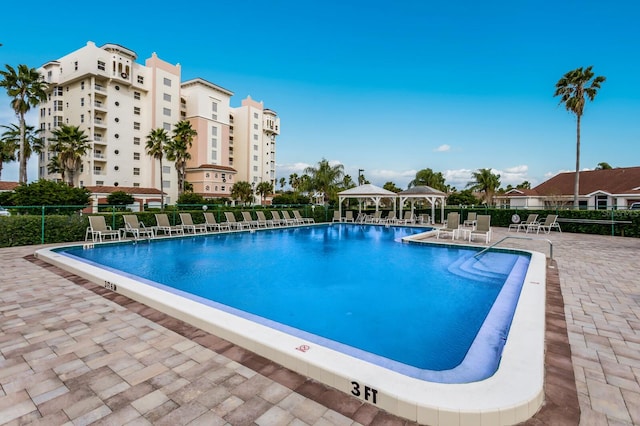 view of pool featuring a gazebo and a patio area