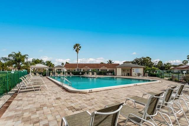 view of pool with a patio area and a gazebo