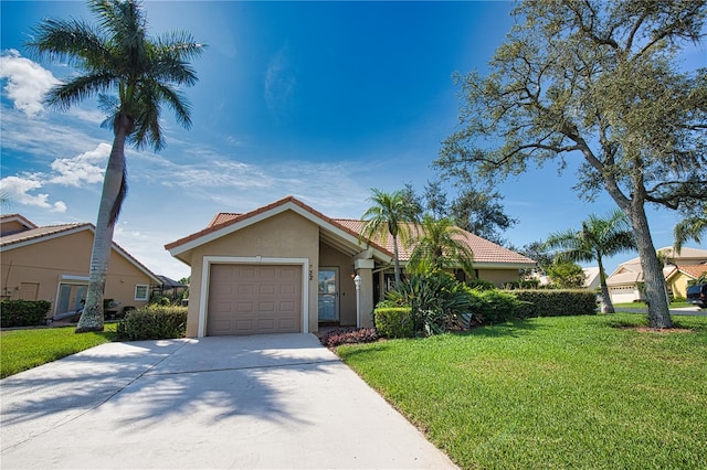 view of front of home featuring a garage and a front lawn