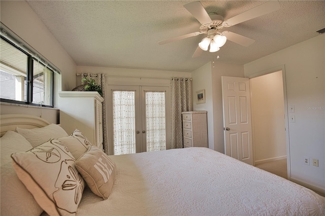 bedroom with ceiling fan, a textured ceiling, french doors, and access to exterior