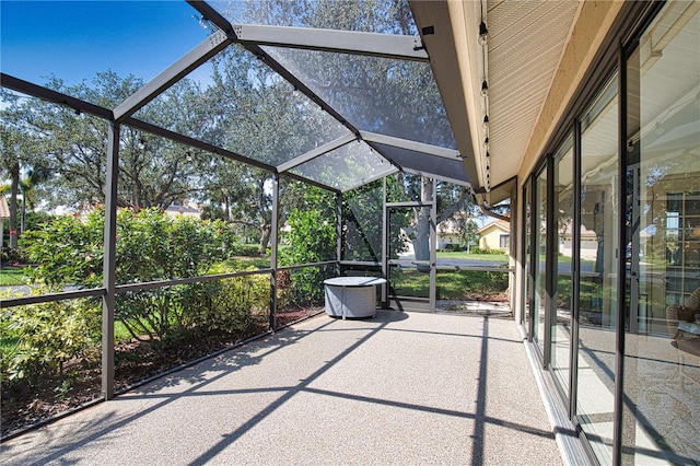 unfurnished sunroom with lofted ceiling