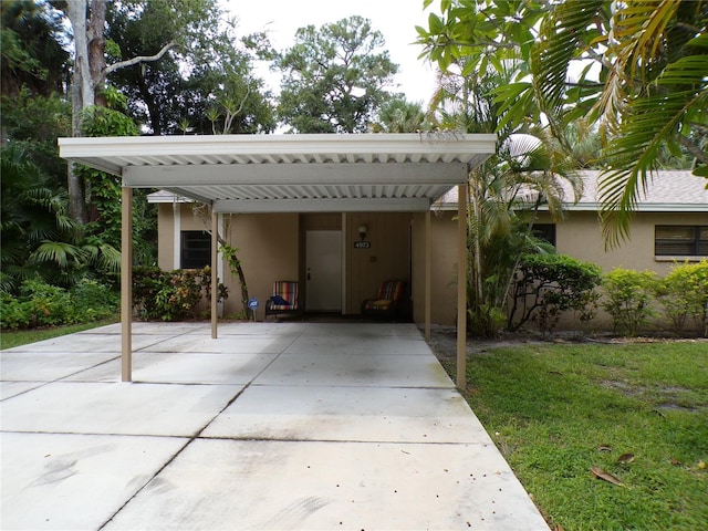 view of car parking with a yard and a carport