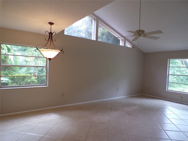 4973 Village Gardens Dr Unit 50, Sarasota, FL 34234 - unfurnished room with a ceiling fan, light tile patterned floors, and high vaulted ceiling