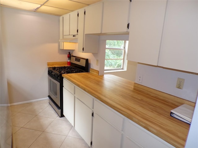 4973 Village Gardens Dr Unit 50, Sarasota, FL 34234 - kitchen with stainless steel gas stove, under cabinet range hood, white cabinets, and light countertops