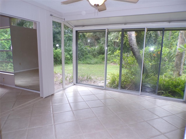 4973 Village Gardens Dr Unit 50, Sarasota, FL 34234 - unfurnished sunroom featuring ceiling fan, tile patterned floors, and healthy amount of natural light