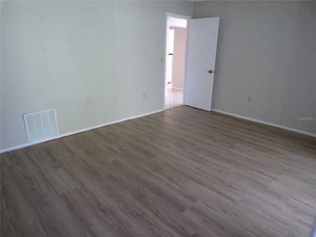 4973 Village Gardens Dr Unit 50, Sarasota, FL 34234 - spare room featuring dark wood finished floors