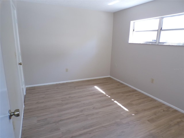 4973 Village Gardens Dr Unit 50, Sarasota, FL 34234 - spare room featuring wood finished floors and baseboards