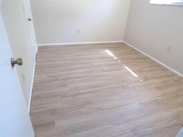 4973 Village Gardens Dr Unit 50, Sarasota, FL 34234 - unfurnished room with light wood-type flooring and baseboards