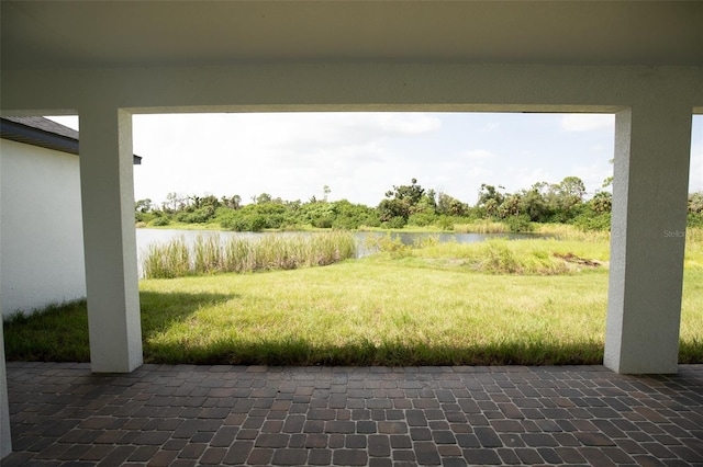 view of patio featuring a water view