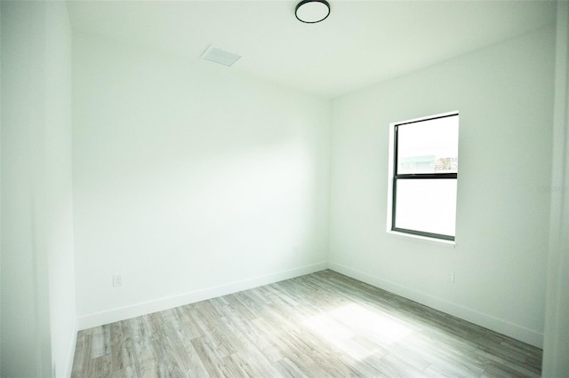 unfurnished room with light hardwood / wood-style floors