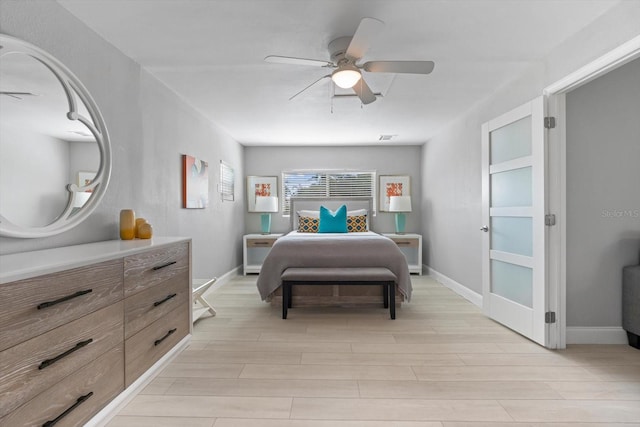 bedroom featuring light hardwood / wood-style flooring and ceiling fan