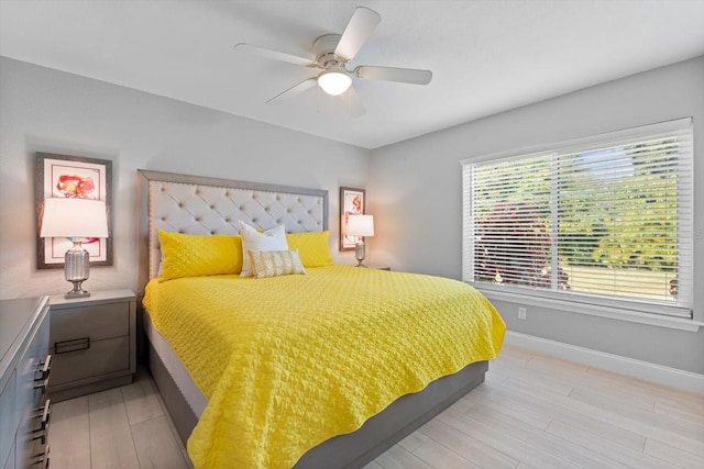 bedroom featuring ceiling fan and light wood-type flooring