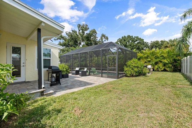 view of yard featuring a pool, a patio area, and a lanai