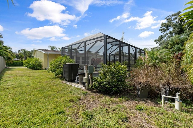 view of yard featuring glass enclosure