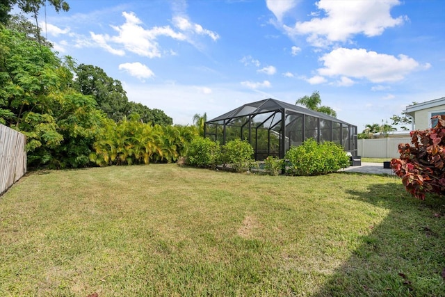 view of yard featuring glass enclosure