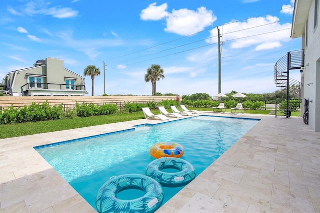 view of swimming pool with a patio area