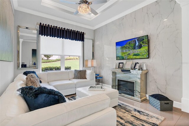 tiled living room featuring tile walls, ceiling fan, and crown molding