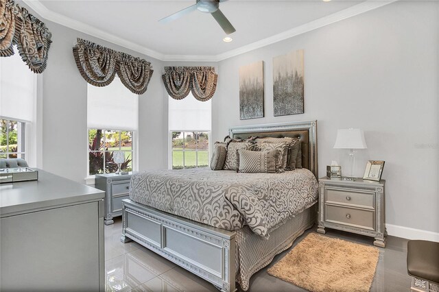 tiled bedroom with crown molding and ceiling fan